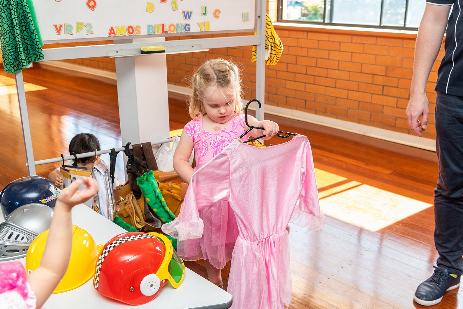 Learning Dressing Skills Through Play